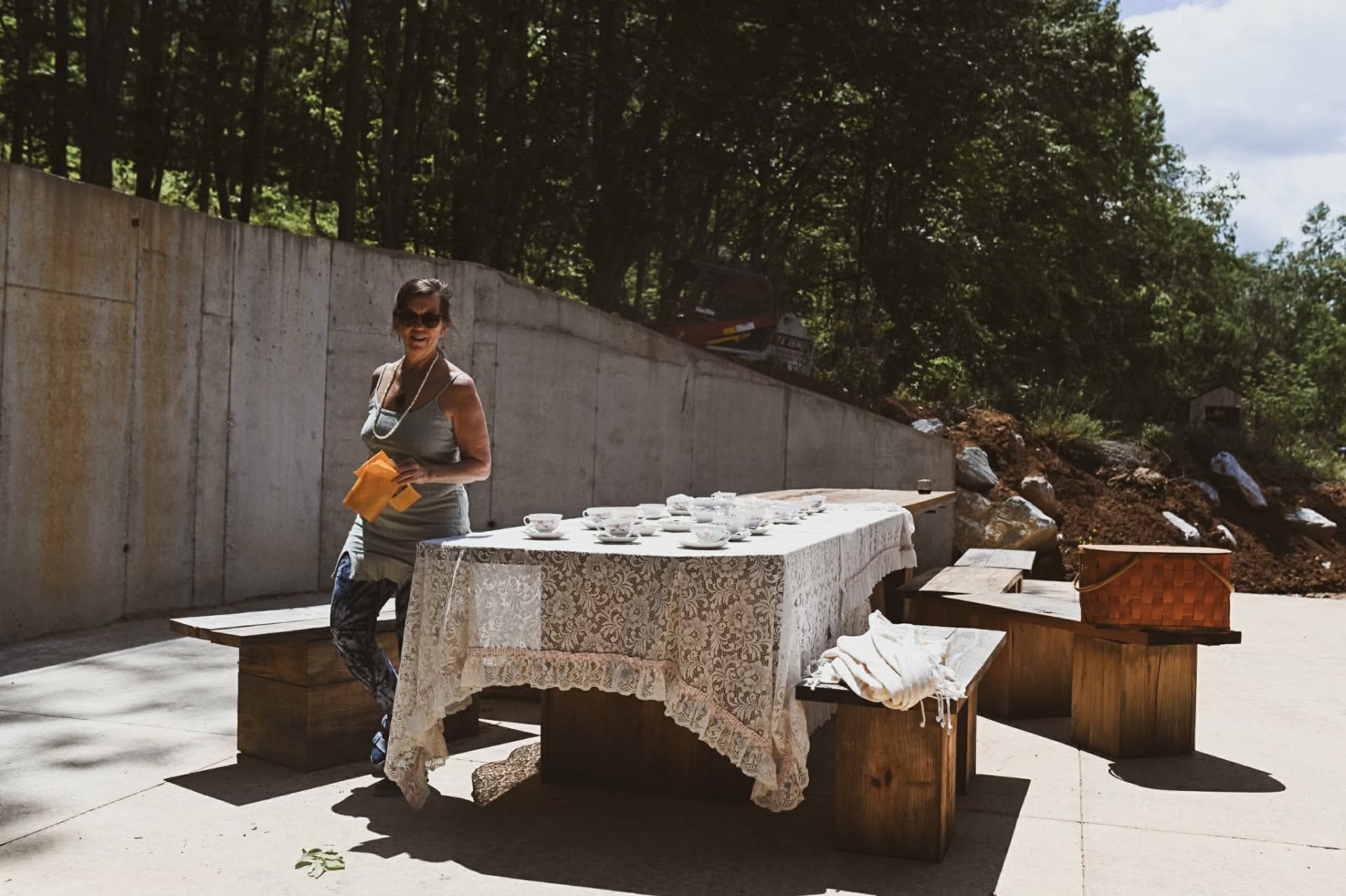 Lace-draped tea table set in the sunshine