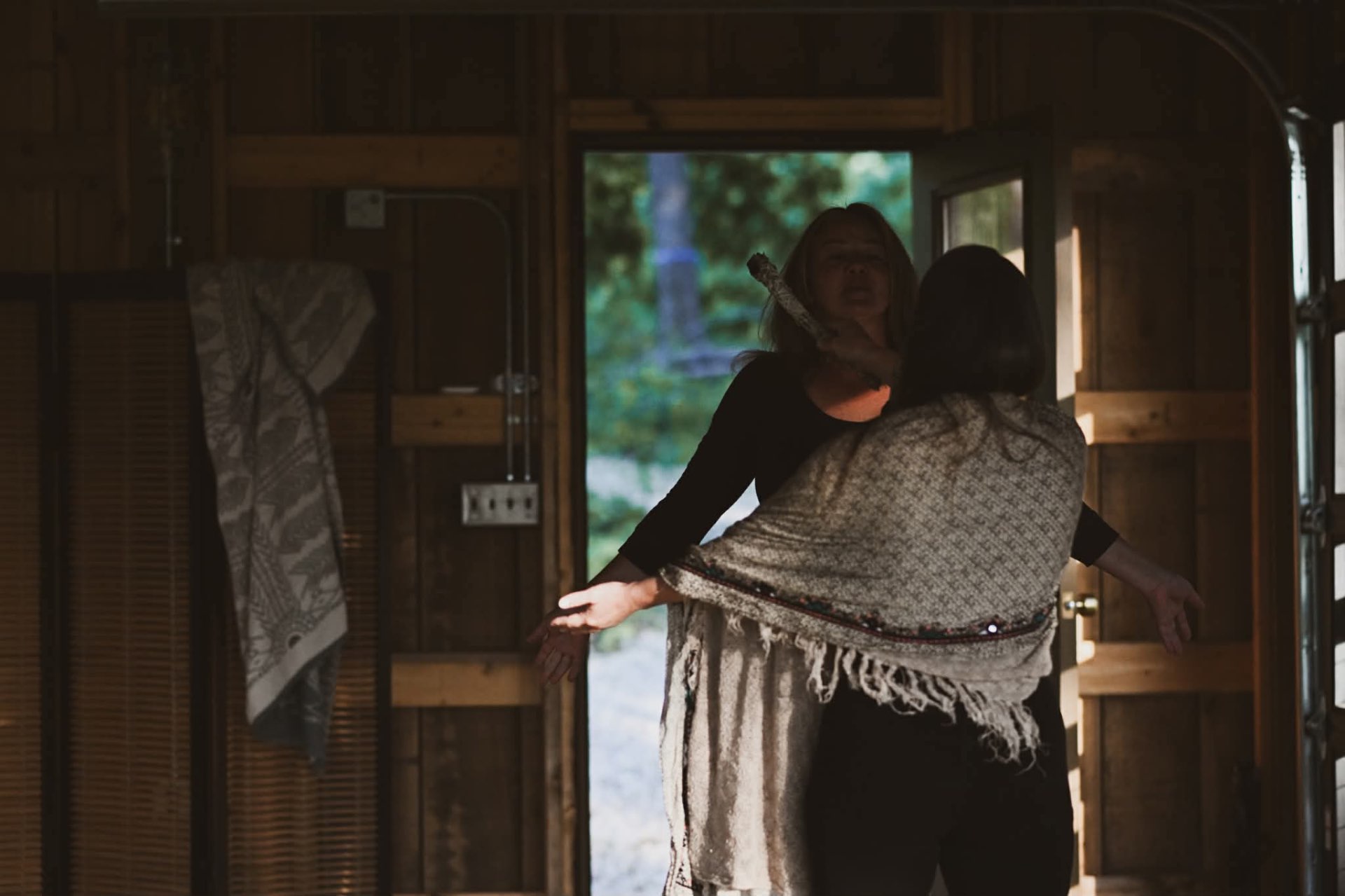 A sacred embrace in the cabin doorway