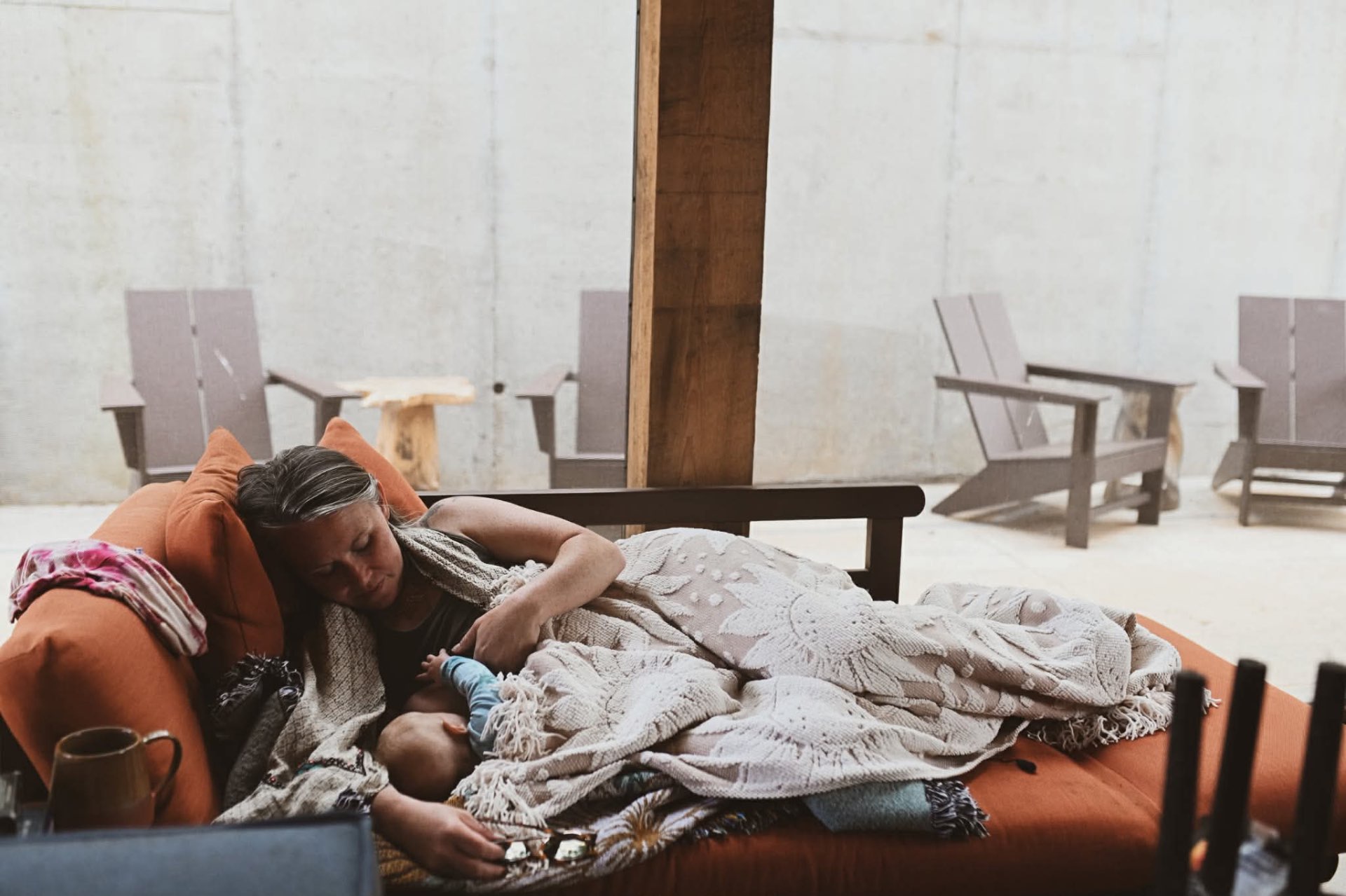 A mother resting with her baby in the sanctuary