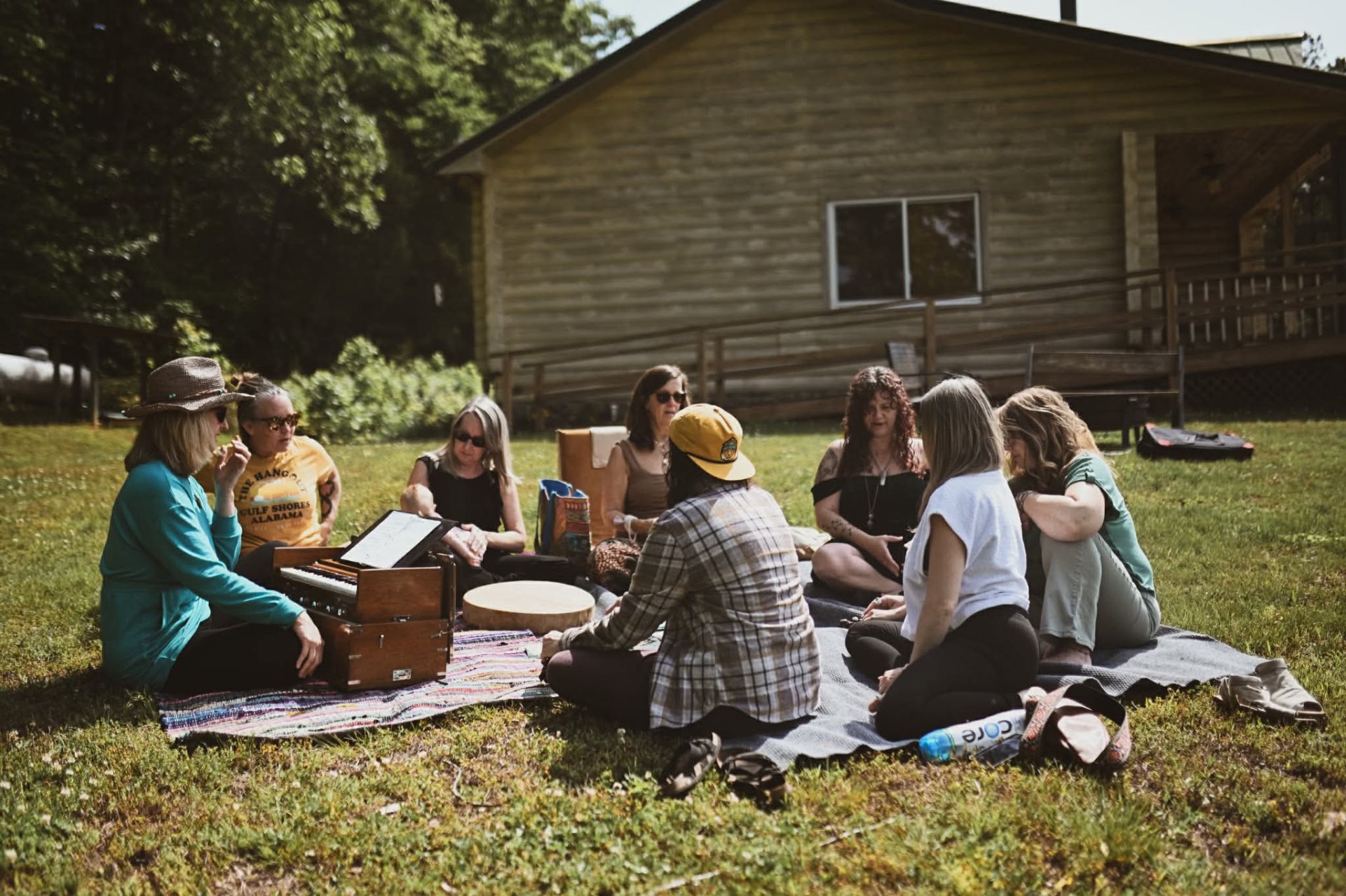 Sisters gathered around the harmonium in song