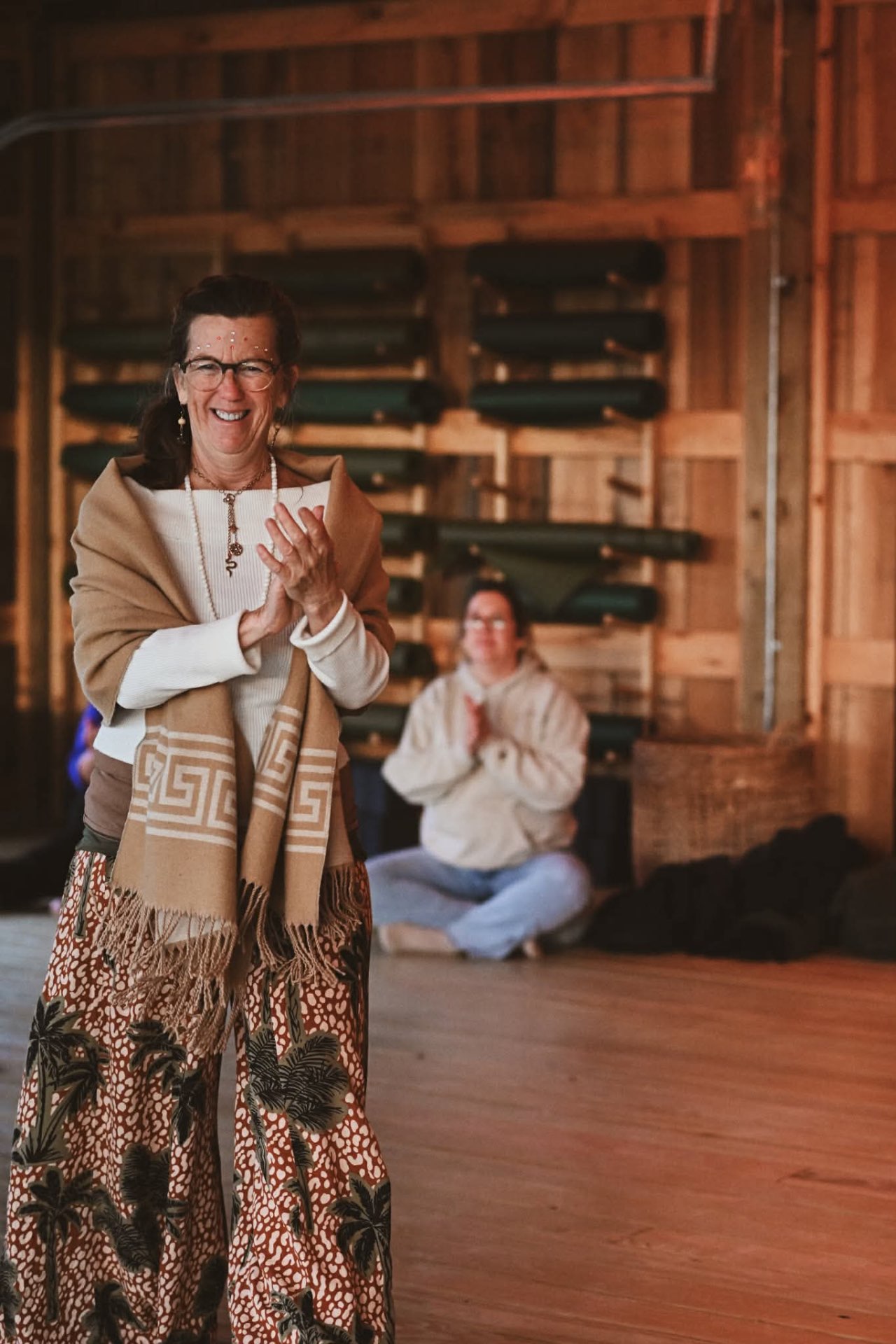 An elder offering a blessing in the great hall